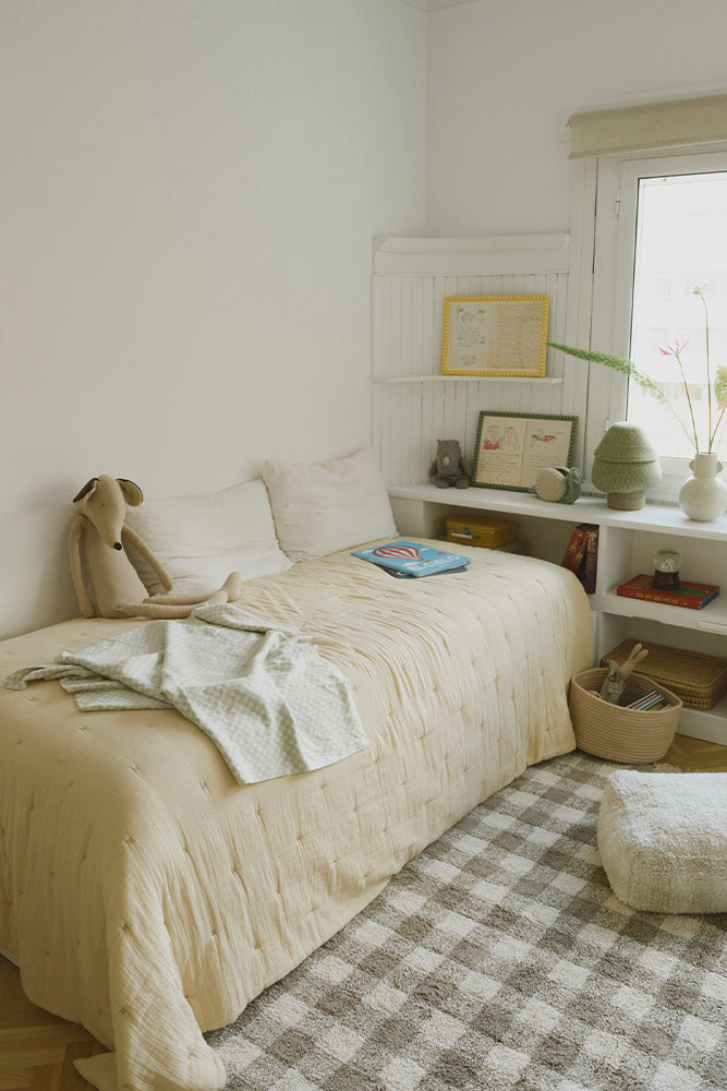 Light Blue Sage Green Checkered Throw Blanket in Kids Bedroom with Brown Checked Rug