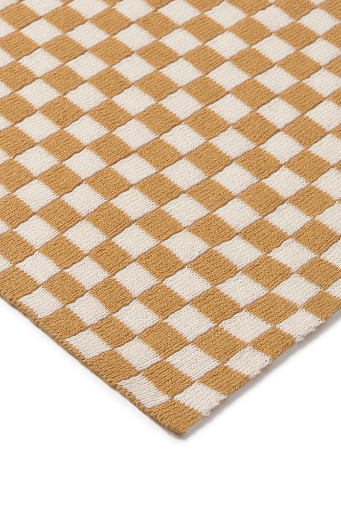 Checkered throw blanket with honey yellow and white squares 