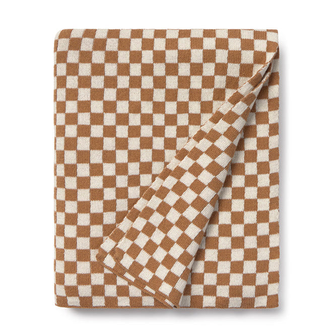 Folded checkered blanket with brown and white pattern