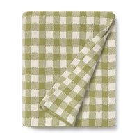 Green and white checkered blanket on a white background
