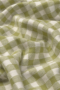 Close-up of green and white checkered blanket