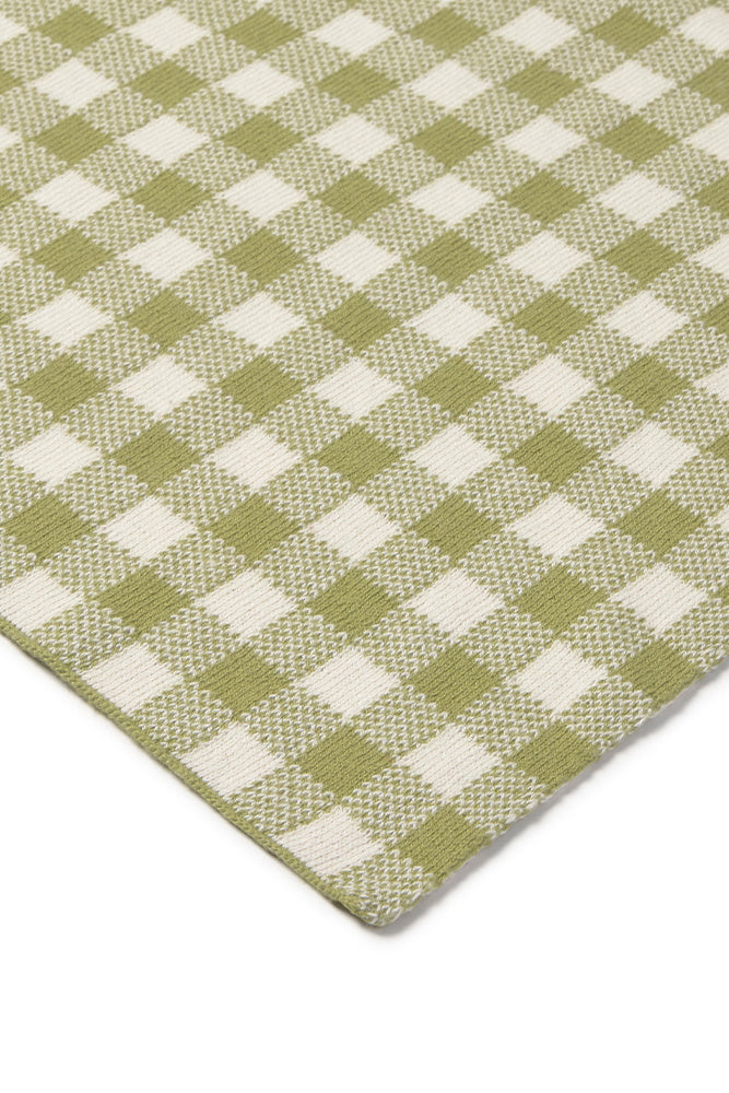 Close-up of a green and white checkered blanket