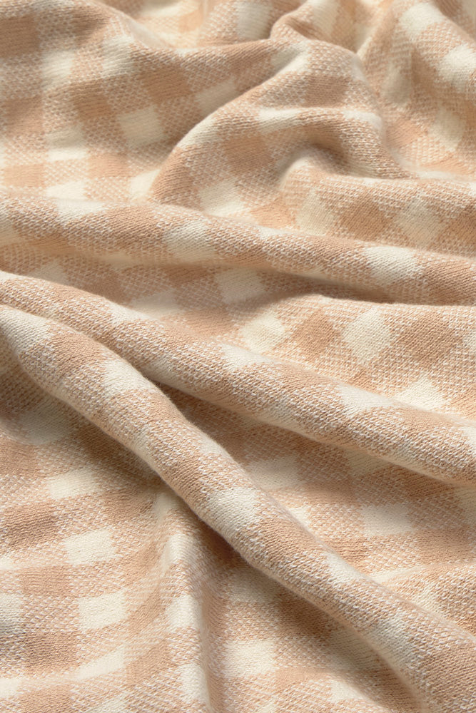 Close-up of rose checkered blanket
