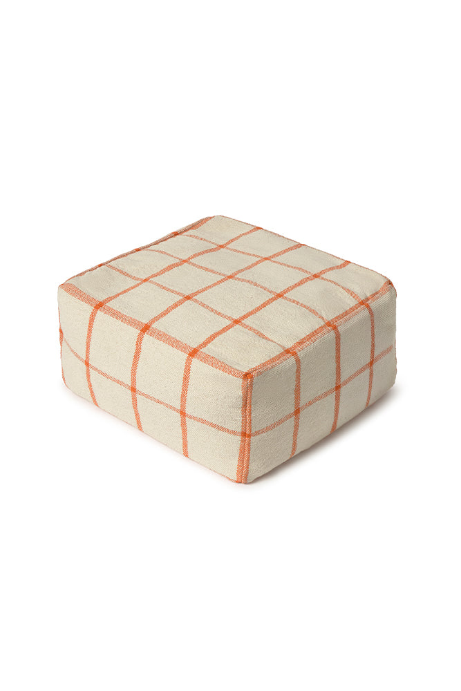 Square pouf ottoman with orange grid pattern 