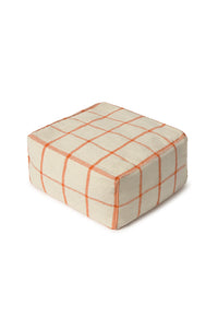 Square pouf ottoman with orange grid pattern 