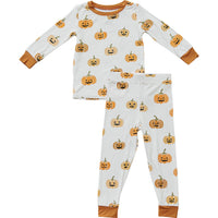 Children's Halloween pajama set with pumpkin pattern on a white background