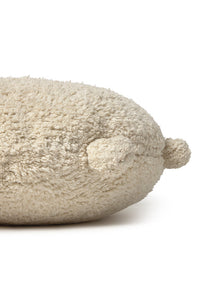 Round natural floor cushion edged with pom-poms