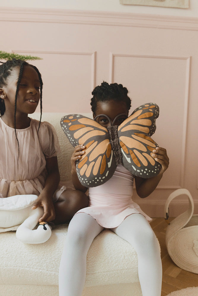 Two Children with Black and Orange Butterfly Pillow