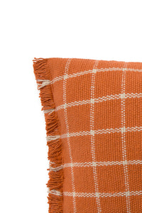 Close up of terracotta orange throw pillow