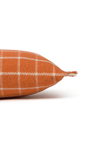 Close up of terracotta orange throw pillow